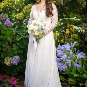 Brand new Wedding Dress. Never worn, white, size 4, in perfect condition.